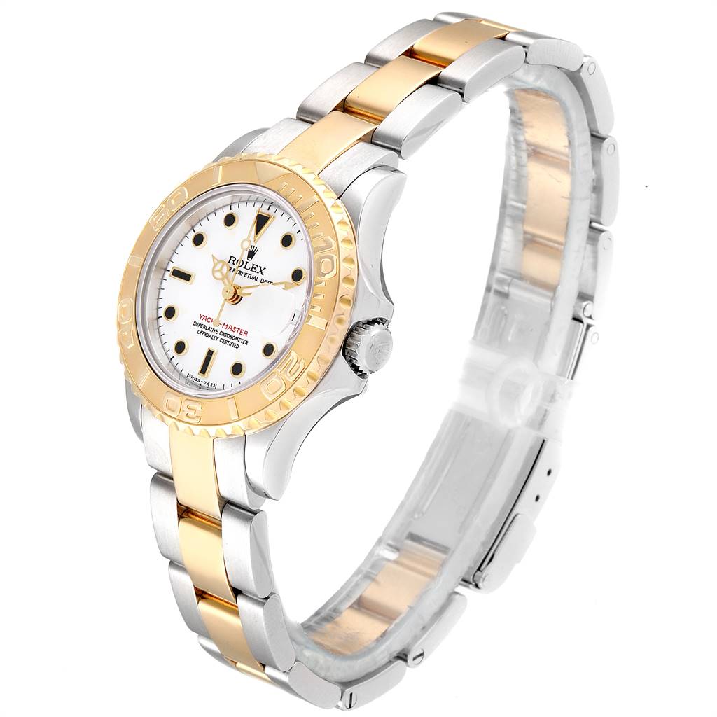 The Rolex Yacht-Master 69623 Women's Steel and Gold (two tone) White Dial 69623 Women's Steel and Gold (two tone) White Dial watch is shown at a three-quarter angle, highlighting its bezel, dial, and two-tone bracelet.