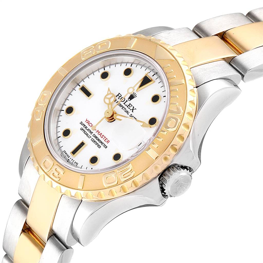 A Rolex Yacht-Master 69623 Women's Steel and Gold (two tone) White Dial 69623 Women's Steel and Gold (two tone) White Dial watch is shown from an oblique angle, highlighting the face, crown, bezel, and part of the band.