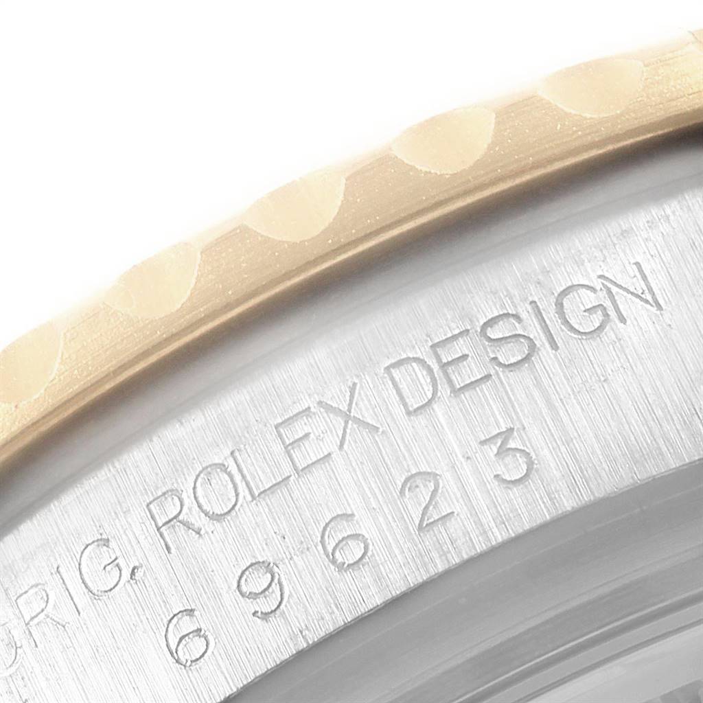 The image shows a close-up of the bezel and part of the case back engraving of the Rolex Yacht-Master 69623 Women's Steel and Gold (two tone) White Dial 69623 Women's Steel and Gold (two tone) White Dial watch.