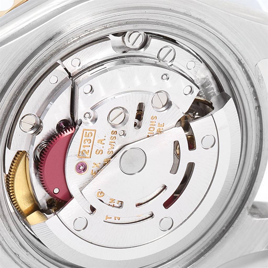 This image shows a close-up view of the movement mechanism of the Rolex Yacht-Master 69623 Women's Steel and Gold (two tone) White Dial 69623 Women's Steel and Gold (two tone) White Dial watch.