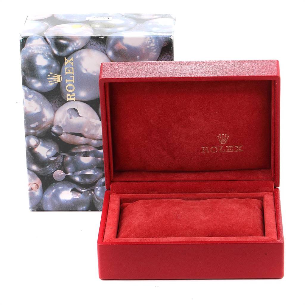 The image shows a red Rolex watch box and outer packaging for the Yacht-Master model.