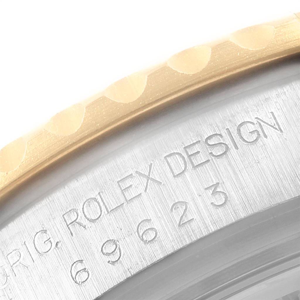 The image shows a close-up of the bezel and casing with "Rolex Design" engraving on the Rolex Yacht-Master 69623 Women's Steel and Gold (two tone) White Dial 69623 Women's Steel and Gold (two tone) White Dial watch.
