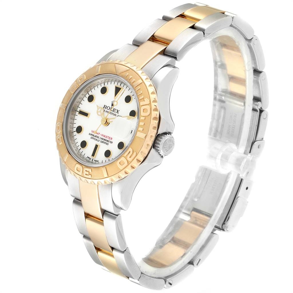 The Rolex Yacht-Master 69623 Women
s Steel and Gold (two tone) White Dial 69623 Women
s Steel and Gold (two tone) White Dial watch is shown at a three-quarter angle, displaying the face, bezel, crown, and two-tone bracelet.