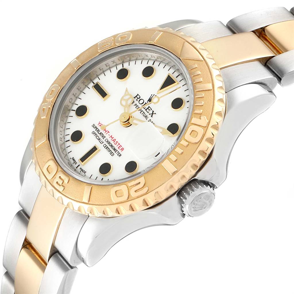 The angle showcases the Rolex Yacht-Master 69623 Women
s Steel and Gold (two tone) White Dial 69623 Women
s Steel and Gold (two tone) White Dial
s face, bezel, crown, and part of its bracelet.