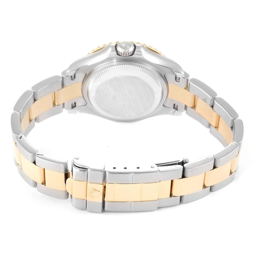 This image shows the back side of a Rolex Yacht-Master 69623 Women
s Steel and Gold (two tone) White Dial 69623 Women
s Steel and Gold (two tone) White Dial watch, highlighting its two-tone bracelet and clasp.