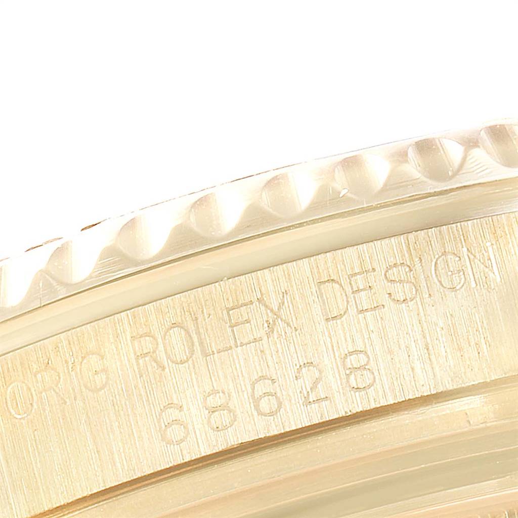 This image shows a close-up of the side casing with the model number and bezel edge of a Rolex Yacht-Master 68628 Yellow Gold White Dial 68628 Yellow Gold White Dial watch.