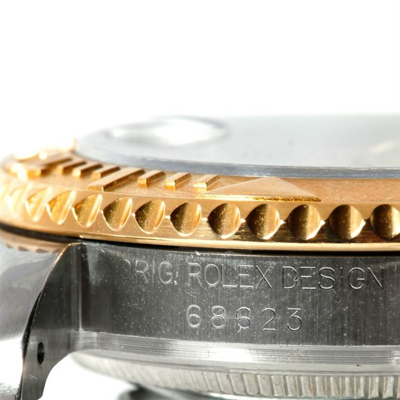 The image shows a close-up side view of the Yacht-Master Rolex bezel and case with the model number engravings.