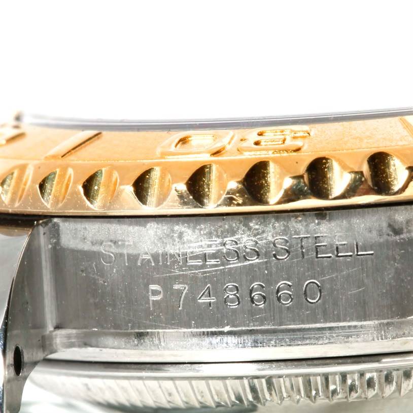 The image shows a close-up of the side of the Rolex Yacht-Master 169623 Women's Stainless Steel Mother of Pearl Dial 169623 Women's Stainless Steel Mother of Pearl Dial's bezel and case, highlighting its stainless steel material and serial number.