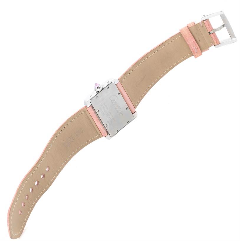 The image shows the back of a Cartier Tank Divan W6301455 Women's Stainless Steel Mother of Pearl Dial W6301455 Women's Stainless Steel Mother of Pearl Dial watch with a partially visible pink leather strap and buckle.