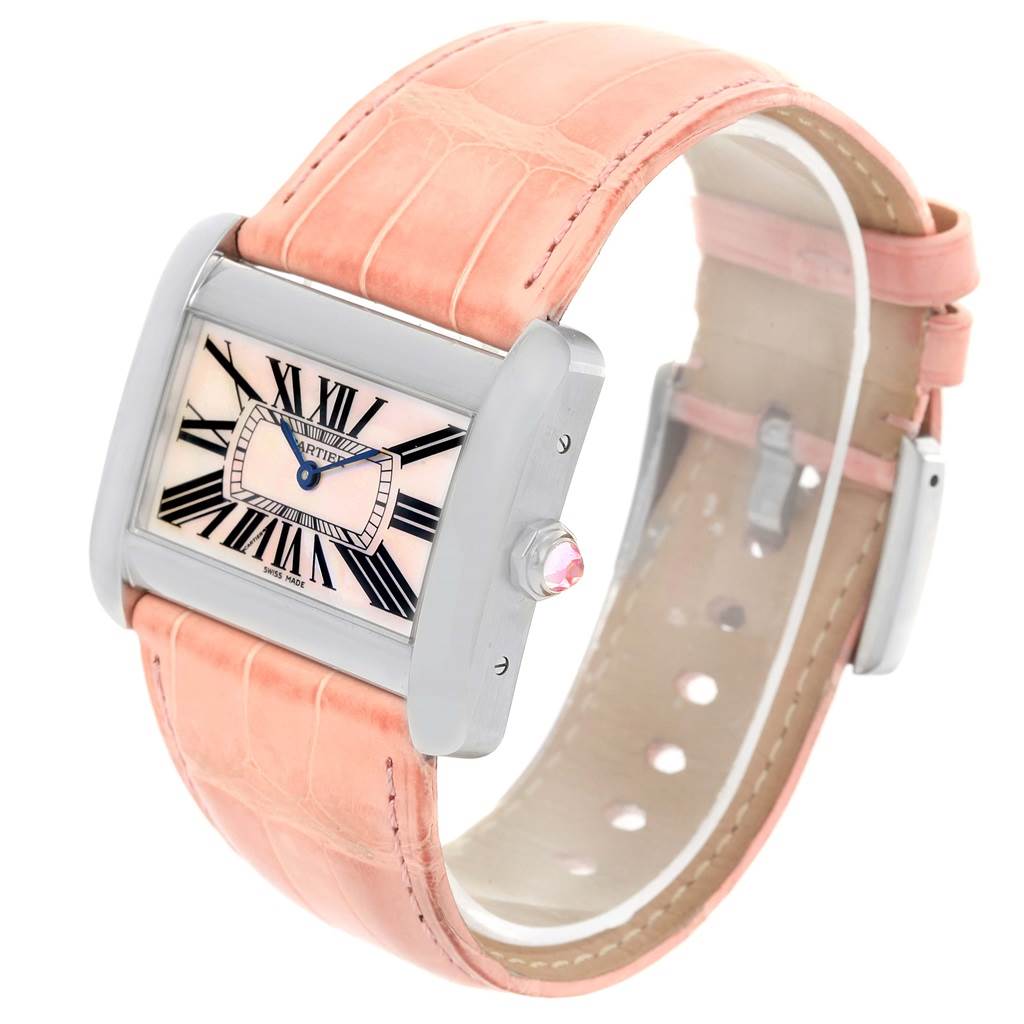 The Cartier Tank Divan W6301455 Women's Stainless Steel Mother of Pearl Dial W6301455 Women's Stainless Steel Mother of Pearl Dial watch is shown at a side angle highlighting the rectangular face, pink strap, and crown with a gemstone.
