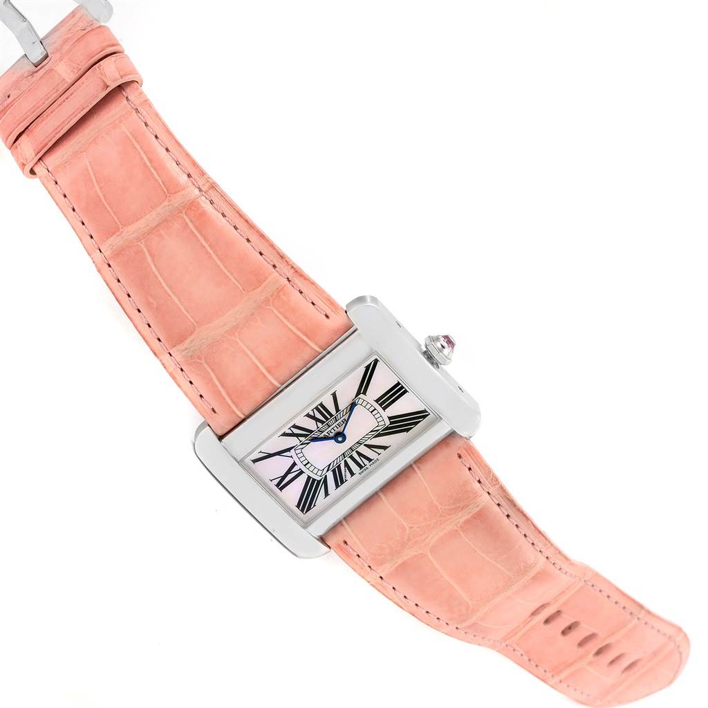 The Cartier Tank Divan W6301455 Women's Stainless Steel Mother of Pearl Dial W6301455 Women's Stainless Steel Mother of Pearl Dial watch is shown at an oblique angle, highlighting its rectangular face, Roman numerals, and pink leather strap.