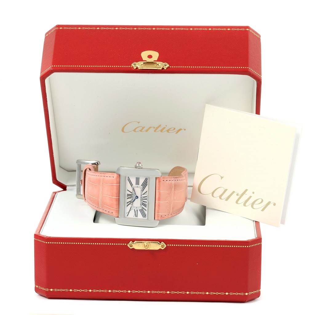 The Cartier Tank Divan W6301455 Women's Stainless Steel Mother of Pearl Dial W6301455 Women's Stainless Steel Mother of Pearl Dial watch is shown from a front angle, displayed inside its red box with a cream-colored strap and a manual beside it.