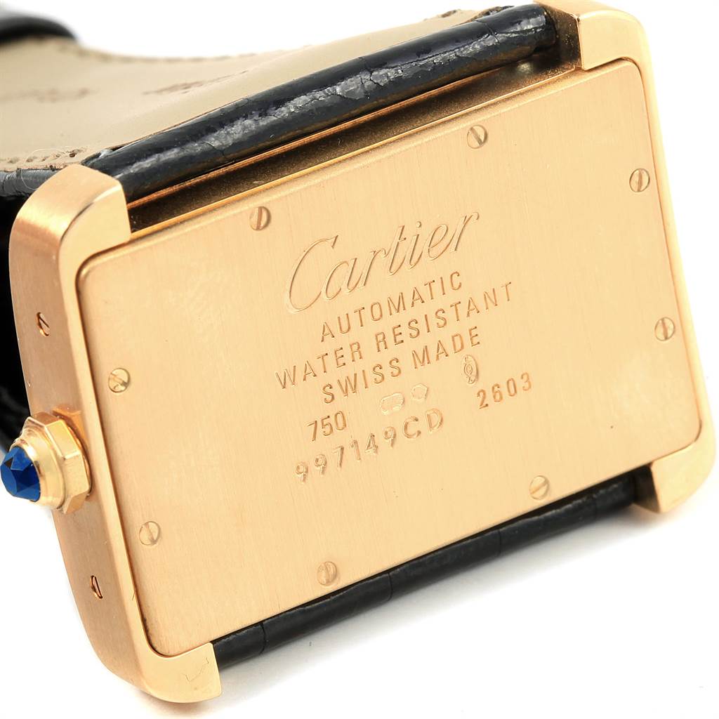 This image shows the back case of the Cartier Tank Divan W6300856 Women's Yellow Gold Silver Dial W6300856 Women's Yellow Gold Silver Dial watch, highlighting its markings and crown.