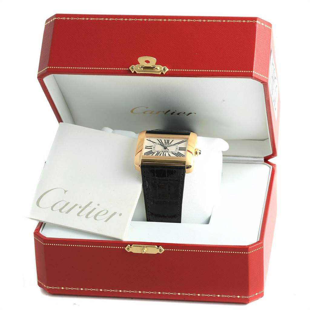 The Cartier Tank Divan W6300856 Women's Yellow Gold Silver Dial W6300856 Women's Yellow Gold Silver Dial watch is displayed frontally in an open red Cartier box, featuring the dial, strap, and a booklet.