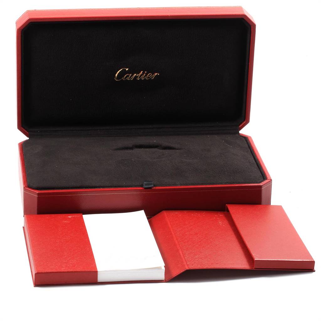 The image shows the open red storage case and box, with the Cartier logo, for the Tank Divan watch model by Cartier.