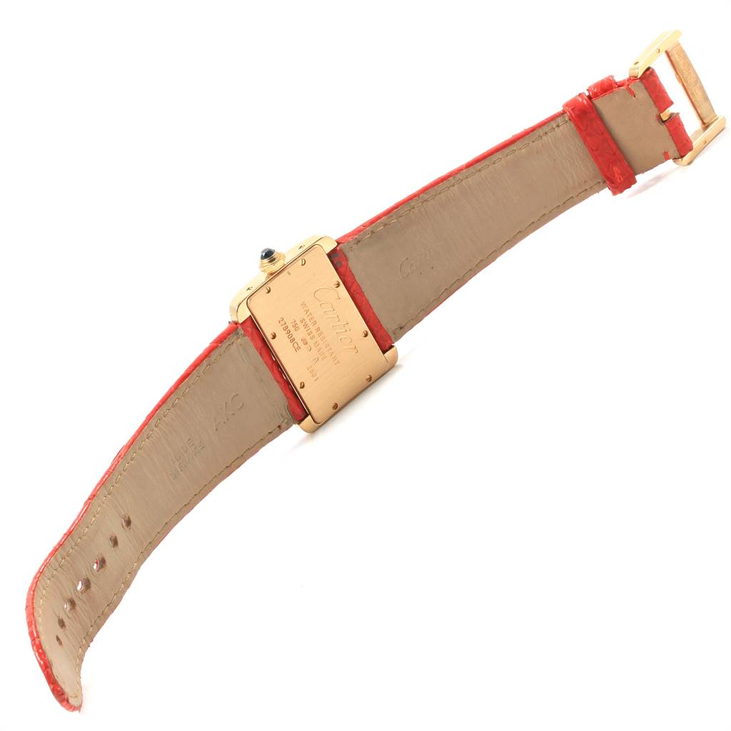 The image shows the back view of a Cartier Tank Divan W6300356 Women's Yellow Gold Silver Dial W6300356 Women's Yellow Gold Silver Dial watch with a red leather strap and gold buckle.
