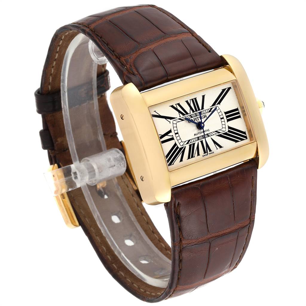 The image shows a Cartier Tank Divan W6300856‏ Women's Yellow Gold Silver Dial W6300856‏ Women's Yellow Gold Silver Dial watch from a side angle, highlighting its rectangular face, Roman numerals, and brown leather strap.