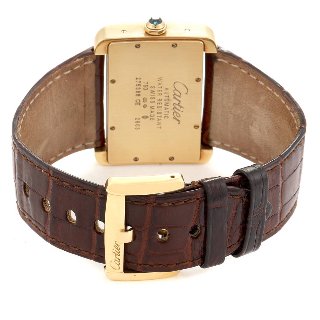 The image shows the back view of a Cartier Tank Divan W6300856‏ Women's Yellow Gold Silver Dial W6300856‏ Women's Yellow Gold Silver Dial watch, focusing on the case back and leather strap with a buckle.