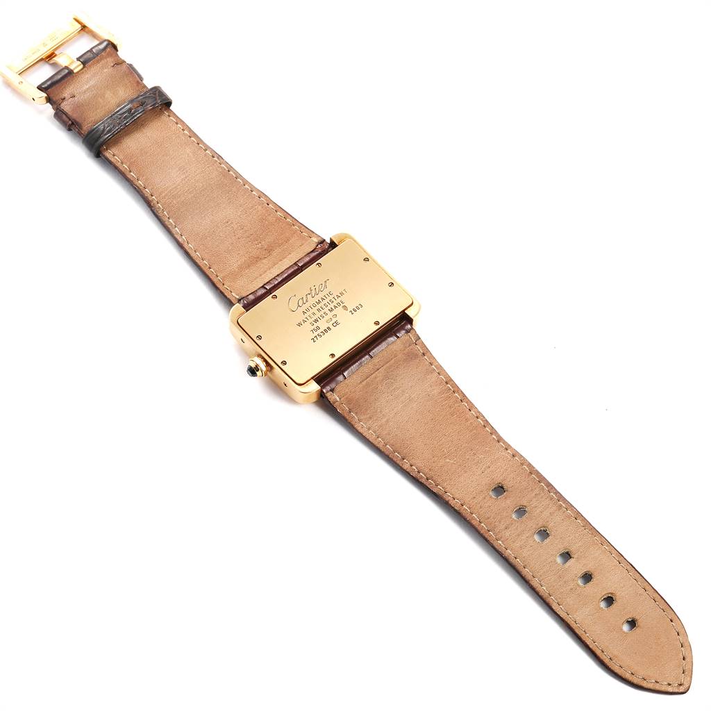 The image shows the back view of a Cartier Tank Divan W6300856‏ Women's Yellow Gold Silver Dial W6300856‏ Women's Yellow Gold Silver Dial watch, displaying its strap and case back.