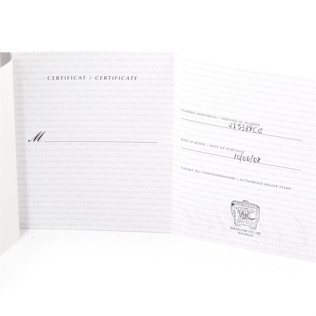 This is a warranty certificate for the Cartier Tank Divan W6300856‏ Women's Yellow Gold Silver Dial W6300856‏ Women's Yellow Gold Silver Dial watch, showing the individual number, purchase date, and dealer stamp.