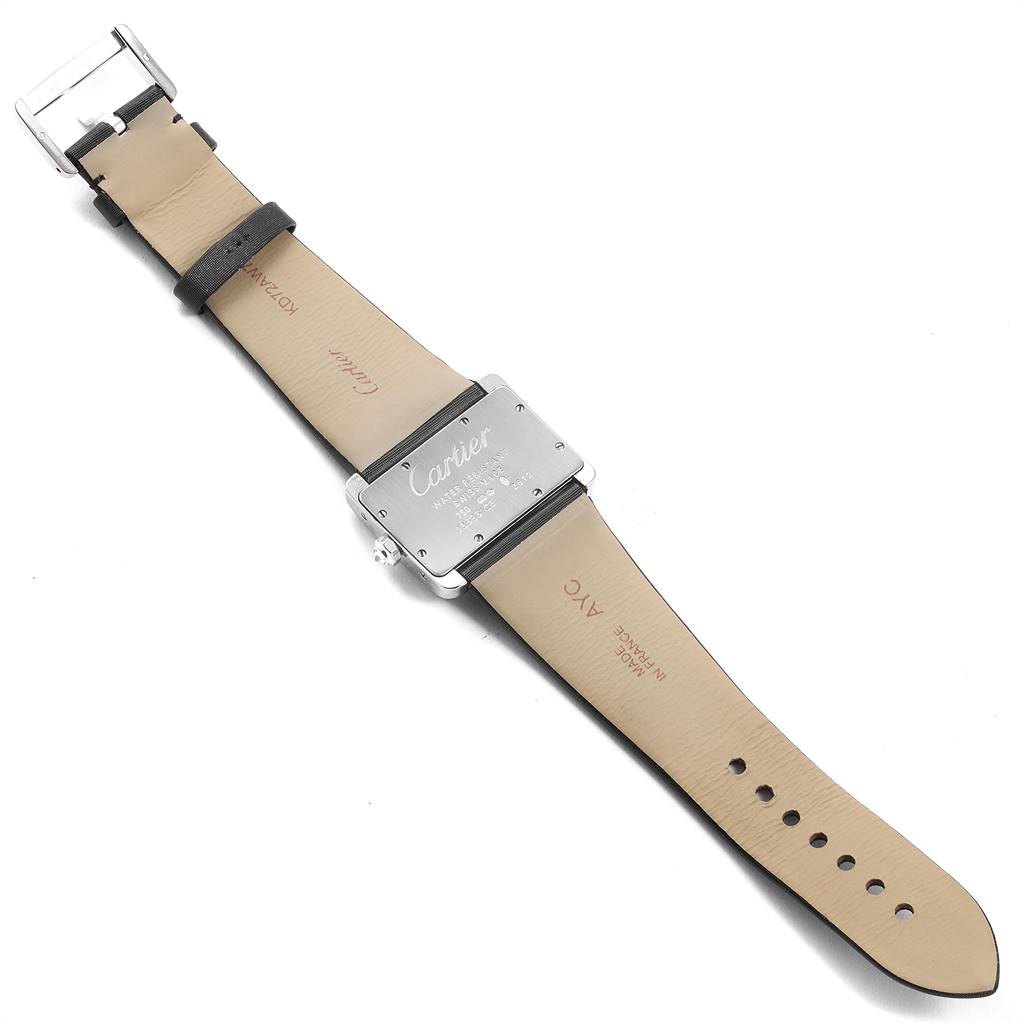 The image shows the back view of a Cartier Tank Divan WA301271 Women's White Gold Silver Dial WA301271 Women's White Gold Silver Dial watch, displaying its leather straps and engraved caseback.