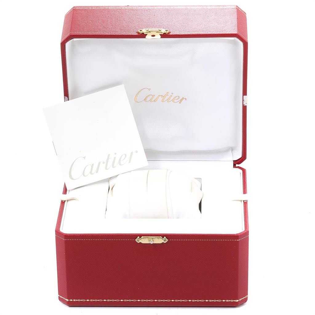 The image shows a Tank Divan model by Cartier in its opened red presentation box with a Cartier booklet.