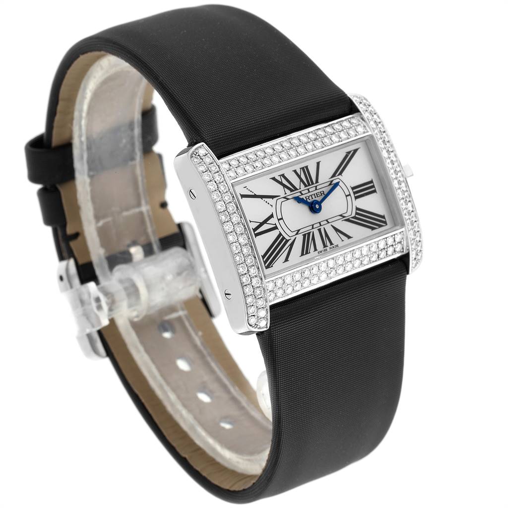 The image shows a Tank Divan model by Cartier from an angled top-side perspective, highlighting the face, bezel, and black strap.