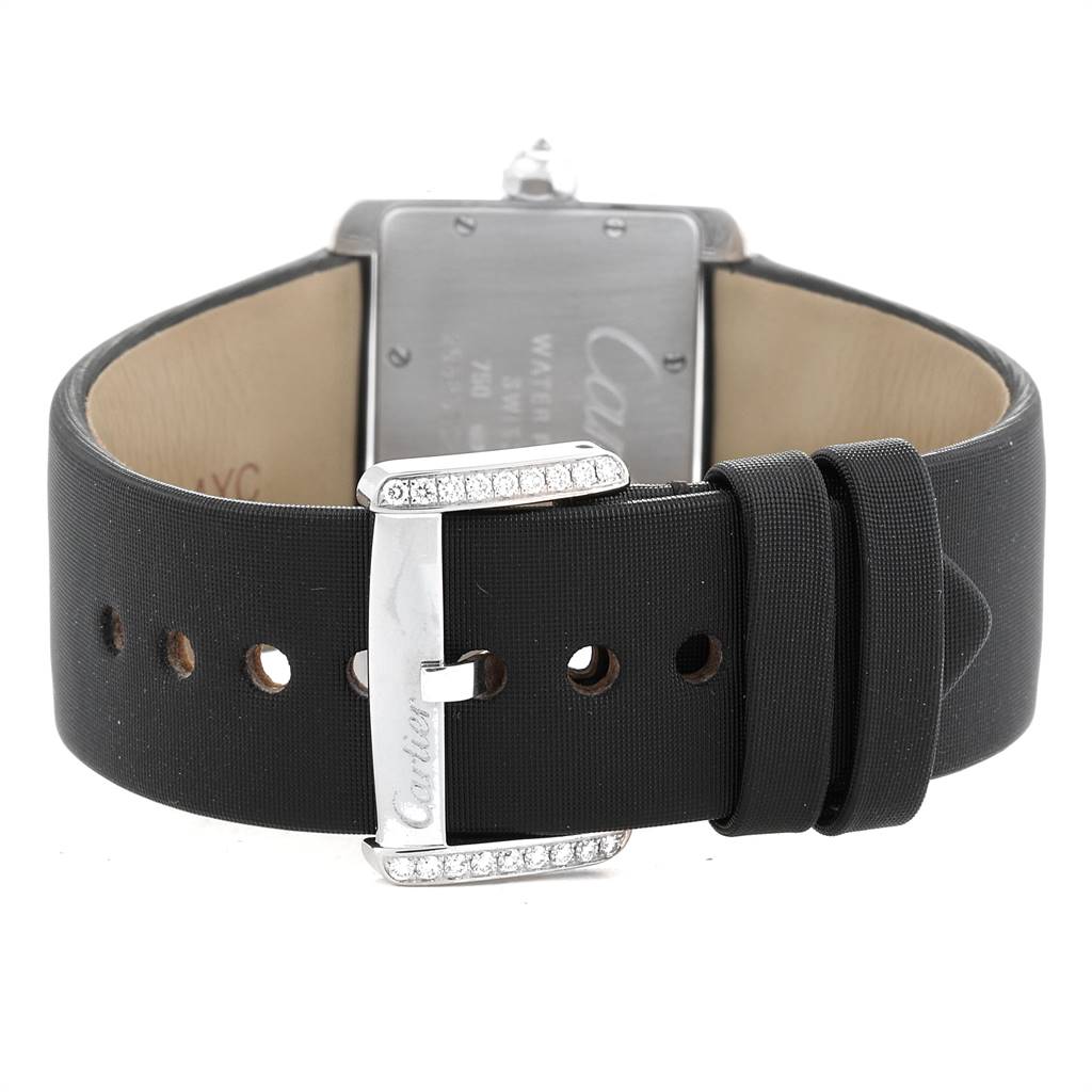 The image shows the back and clasp of a Cartier Tank Divan WA301271 Women's White Gold Silver Dial WA301271 Women's White Gold Silver Dial watch, featuring a black strap and a silver buckle with diamond accents.