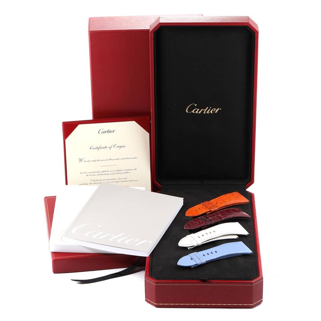 The image shows an open Cartier Tank Divan WA301170‏ Women's Yellow Gold Silver Dial WA301170‏ Women's Yellow Gold Silver Dial watch box with multiple watch straps and documentation.