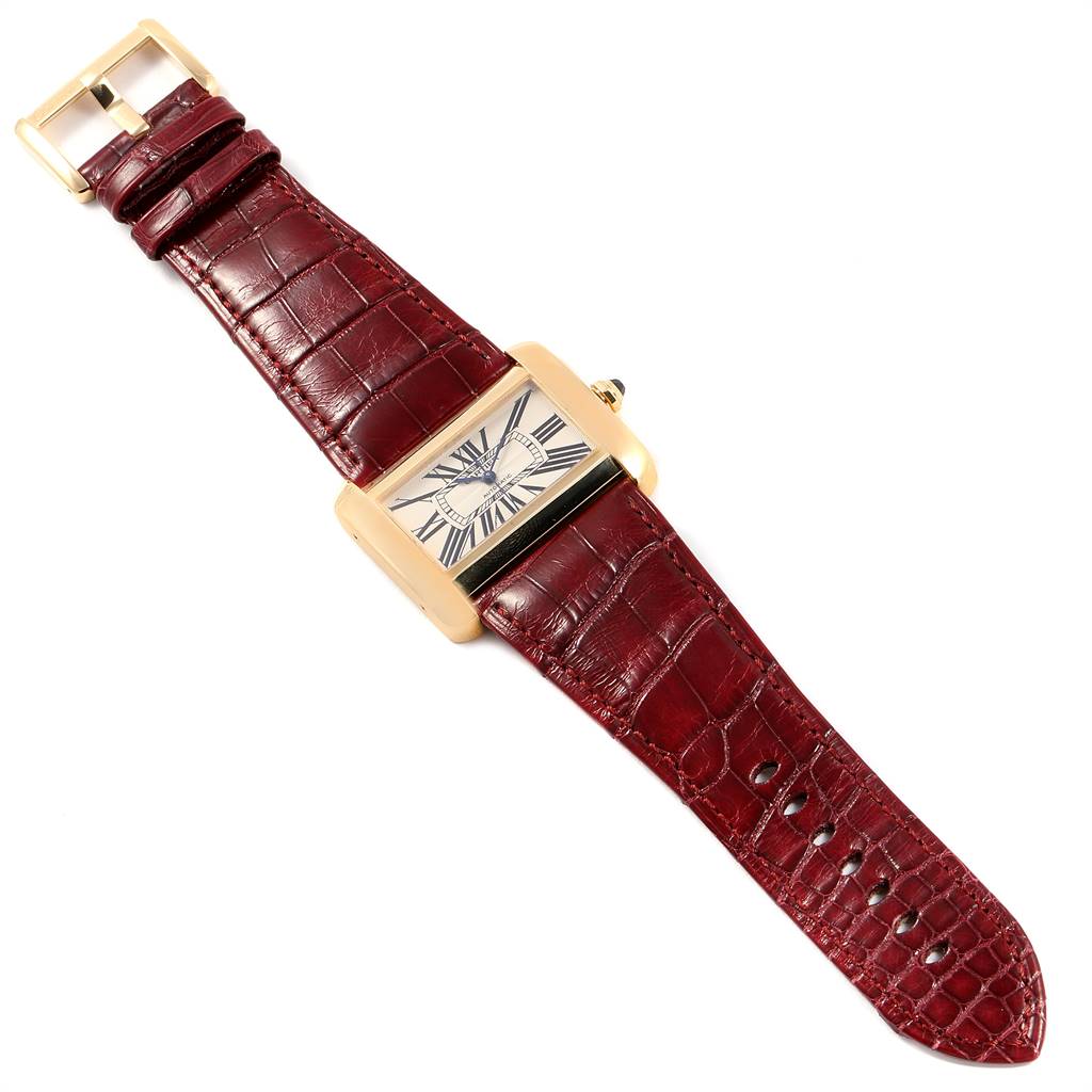 The Cartier Tank Divan W6300856 Women's Yellow Gold Silver Dial W6300856 Women's Yellow Gold Silver Dial watch is shown from a top view, displaying the face, strap, and buckle.