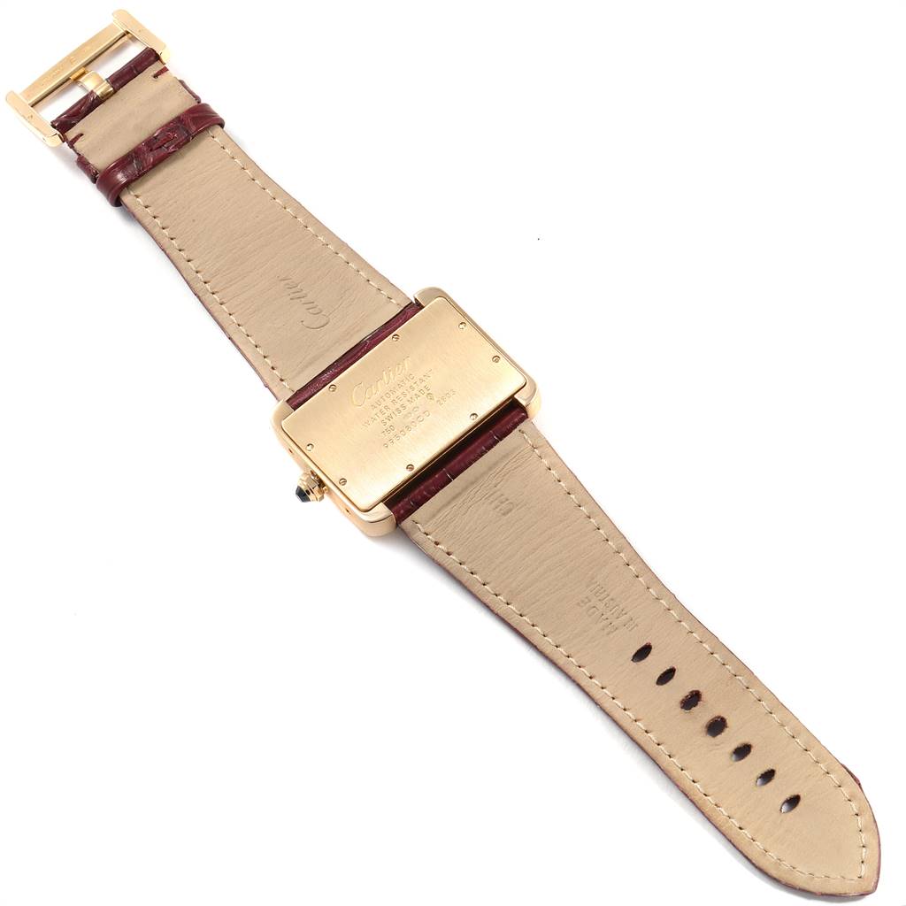 This Tank Divan model by Cartier is shown from the back, displaying the case back, crown, and leather strap with buckle.