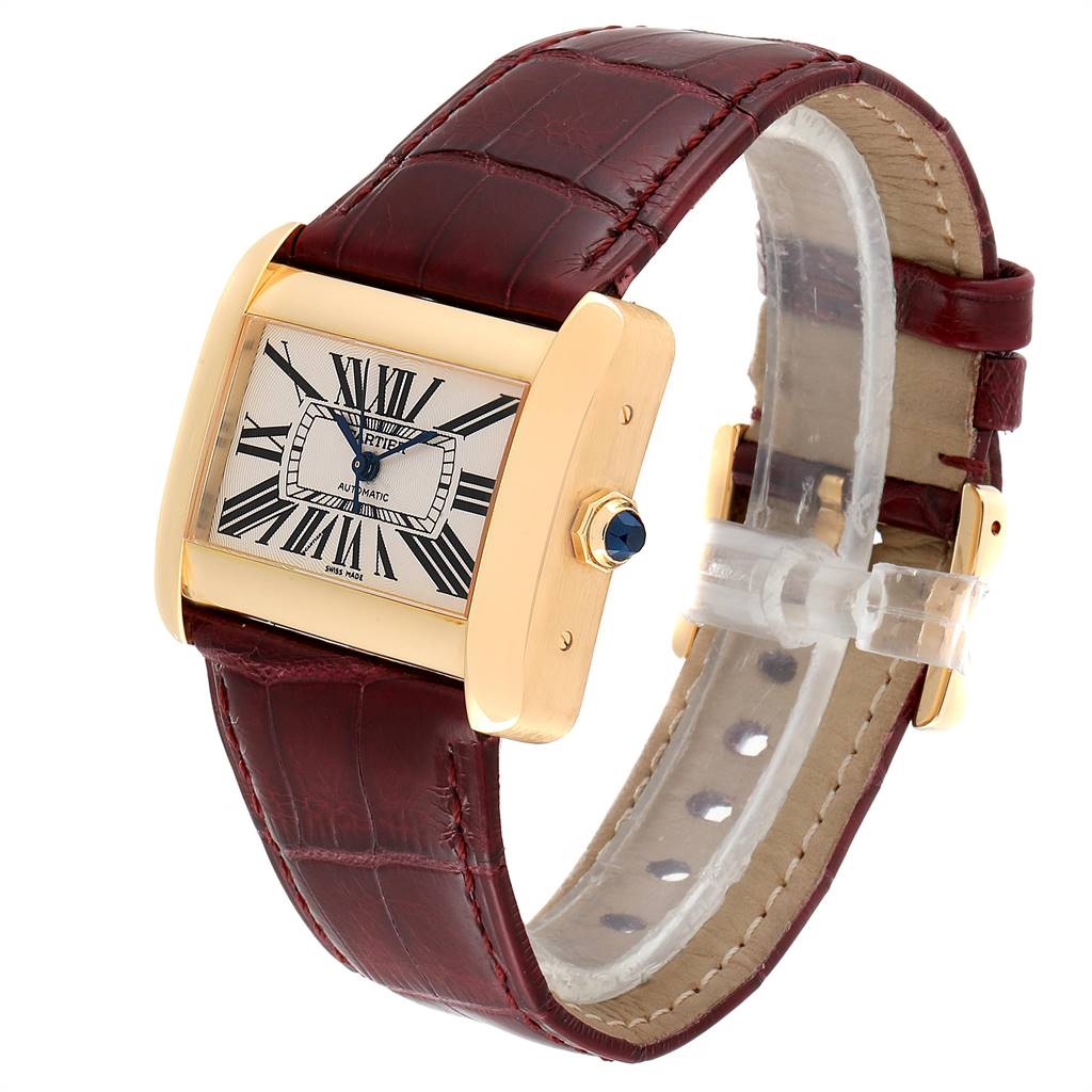 The Cartier Tank Divan W6300856 Women's Yellow Gold Silver Dial W6300856 Women's Yellow Gold Silver Dial watch is displayed at an angle showing the face, brown leather strap, and gold case with a sapphire crown.