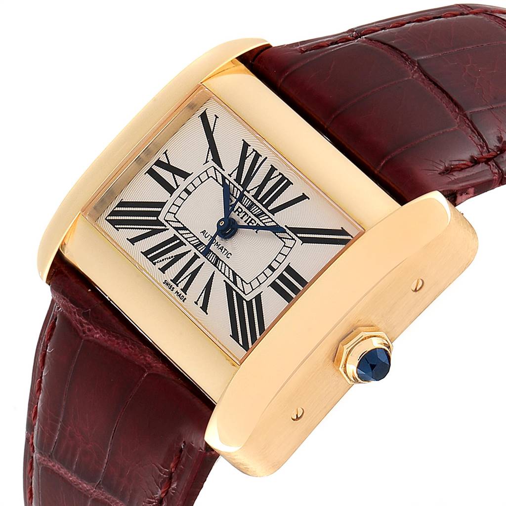 The image shows a close-up of the Cartier Tank Divan W6300856 Women's Yellow Gold Silver Dial W6300856 Women's Yellow Gold Silver Dial watch, focusing on the face, bezel, crown, and part of the leather strap.