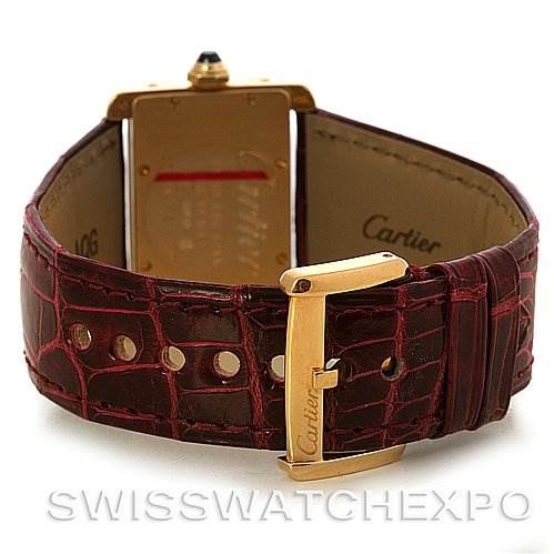 This image shows the back of the Cartier Tank Divan W6300356 Women's Yellow Gold White Dial W6300356 Women's Yellow Gold White Dial watch and its open leather strap.