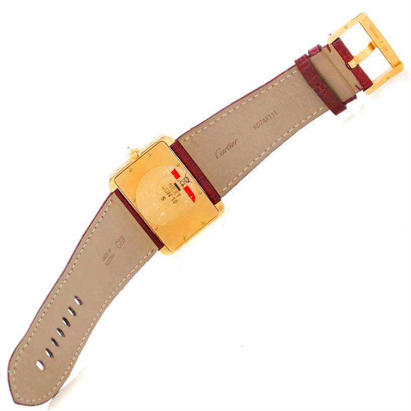 This image shows the back of a Cartier Tank Divan WA301170? Men's Yellow Gold Silver Dial WA301170? Men's Yellow Gold Silver Dial watch, displaying the strap and the caseback.