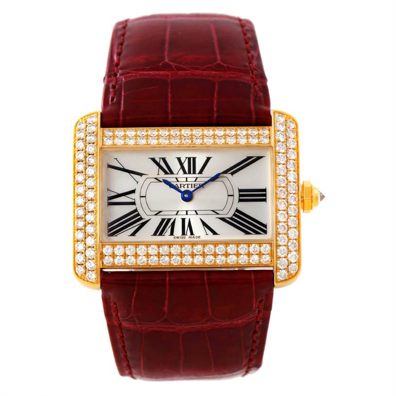 This image shows a Cartier Tank Divan WA301170? Men's Yellow Gold Silver Dial WA301170? Men's Yellow Gold Silver Dial watch from a front-angle, displaying its face, diamond-studded bezel, and red leather strap.