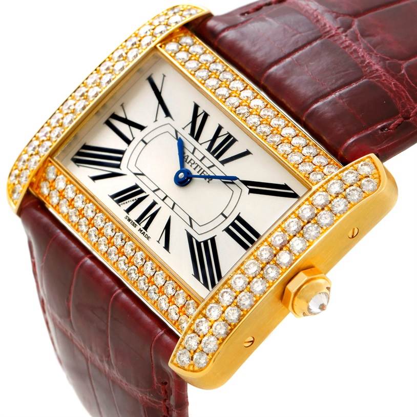 This image shows a Cartier Tank Divan WA301170? Men's Yellow Gold Silver Dial WA301170? Men's Yellow Gold Silver Dial watch from an angled top-down view, highlighting its diamond-studded bezel and leather strap.