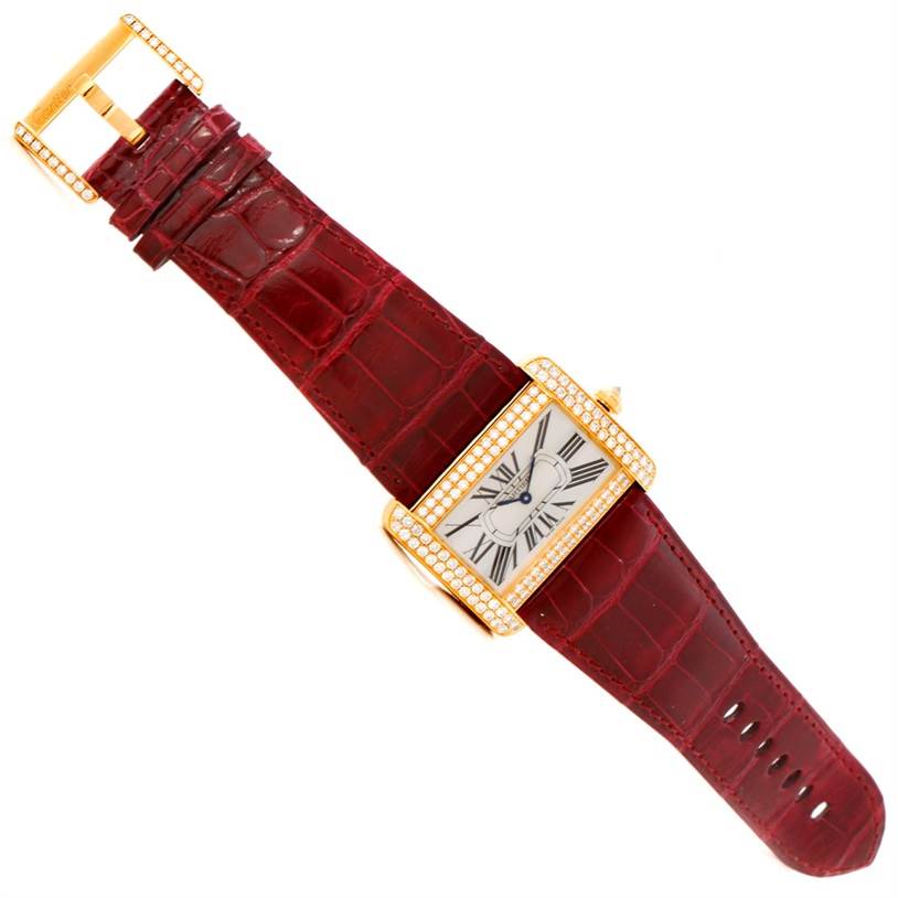 The Cartier Tank Divan WA301170? Men's Yellow Gold Silver Dial WA301170? Men's Yellow Gold Silver Dial watch is shown from a top-down angle, displaying its entire face, strap, and buckle.