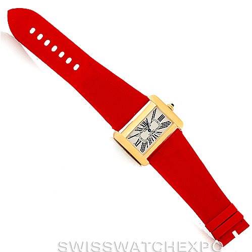 The image shows a top-down view of a Cartier Tank Divan W6300856 Yellow Gold Silver Dial W6300856 Yellow Gold Silver Dial watch with a red strap and a rectangular dial.