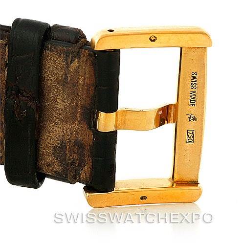 This image shows a close-up of the buckle and strap of a Cartier Tank Divan W6300856 Yellow Gold Silver Dial W6300856 Yellow Gold Silver Dial watch.