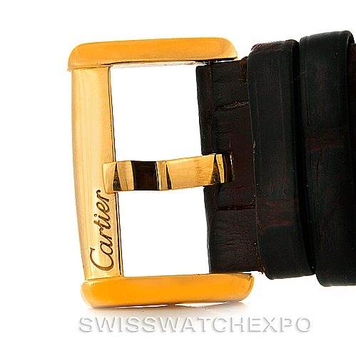 This image shows a close-up of the buckle and strap of a Cartier Tank Divan W6300856 Yellow Gold Silver Dial W6300856 Yellow Gold Silver Dial watch.