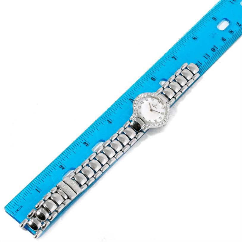 The Ebel E9157428-20 Women's Stainless Steel Mother of Pearl Dial E9157428-20 Women's Stainless Steel Mother of Pearl Dial Beluga Ladies Steel Mother of Pearl Diamond Watch E9157428-20 is shown flat with a blue ruler for size reference.