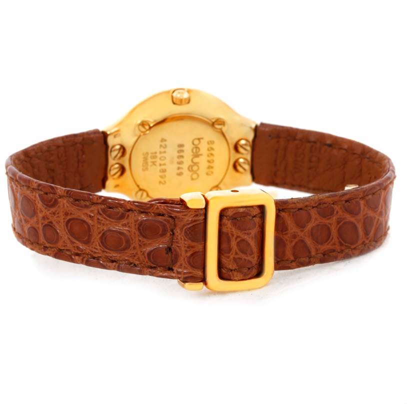 This image shows the back view of the Ebel 866940 Women's Yellow Gold Mother of Pearl Dial 866940 Women's Yellow Gold Mother of Pearl Dial Beluga Ladies Yellow Gold Mother of Pearl Diamond Watch 866940 with its brown strap and gold buckle.