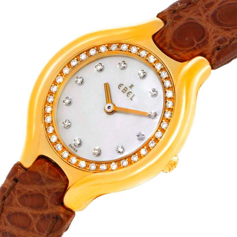 The image shows a close-up of the Ebel 866940 Women's Yellow Gold Mother of Pearl Dial 866940 Women's Yellow Gold Mother of Pearl Dial Beluga Ladies Yellow Gold Mother of Pearl Diamond Watch 866940, focusing on the face, bezel, and part of the strap.