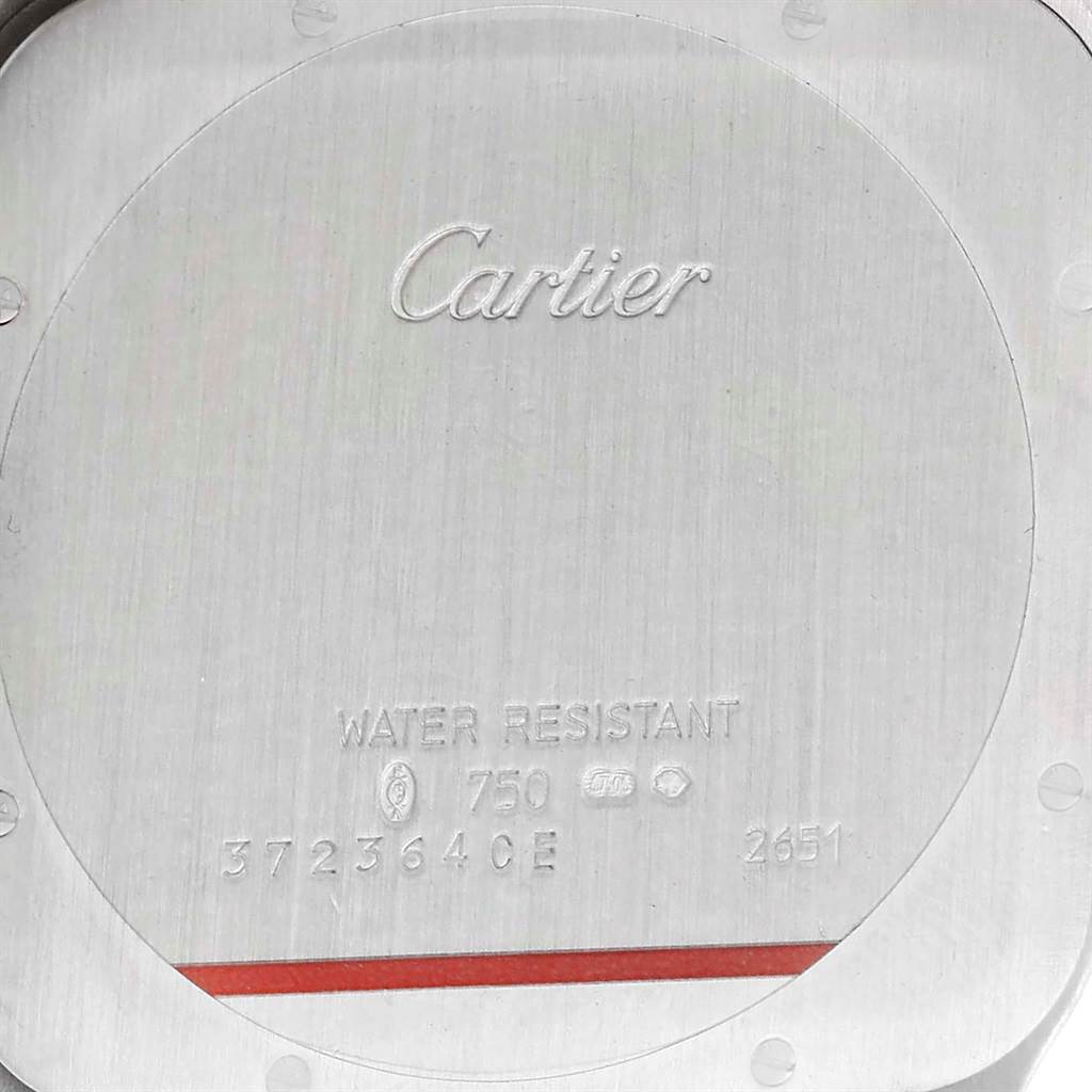 The image shows the case back of a Cartier Santos Dumont W2007051 Men's White Gold Silver Dial W2007051 Men's White Gold Silver Dial watch, displaying the brand name, model, and specifications.