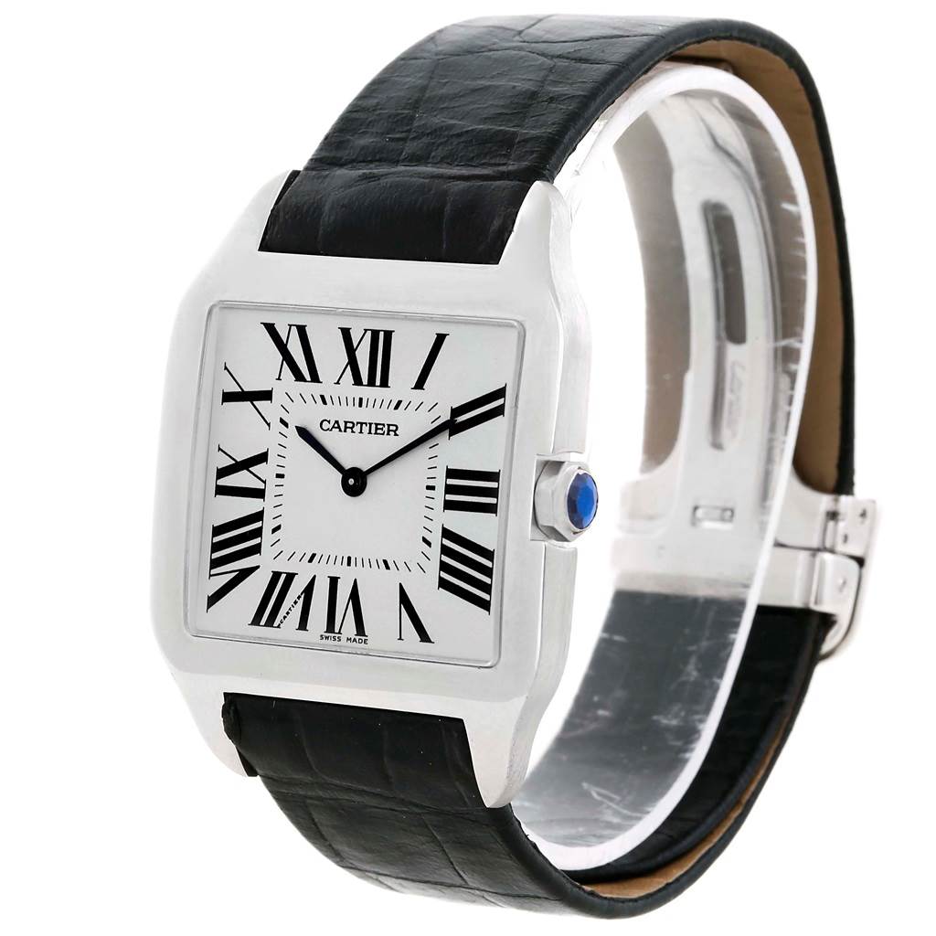 The Cartier Santos Dumont W2007051 Men's White Gold Silver Dial W2007051 Men's White Gold Silver Dial watch is shown at an angled view, displaying the face, crown, and part of the black leather strap.