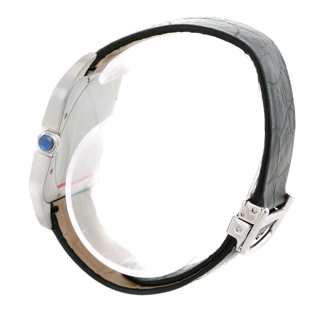 The Cartier Santos Dumont W2007051 Men's White Gold Silver Dial W2007051 Men's White Gold Silver Dial watch is shown from a side angle, highlighting the case, crown, and part of the leather strap and buckle.