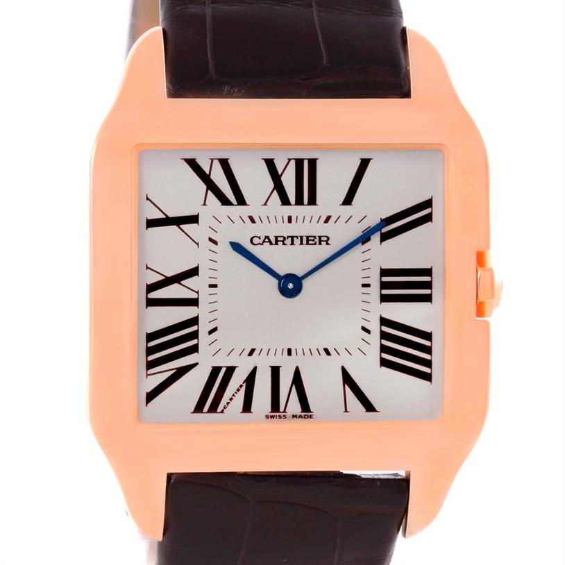 The image shows a front view of the Cartier Santos Dumont W2006951 Men
s Rose Gold Silver Dial W2006951 Men
s Rose Gold Silver Dial watch, highlighting its square face, Roman numerals, and leather strap.