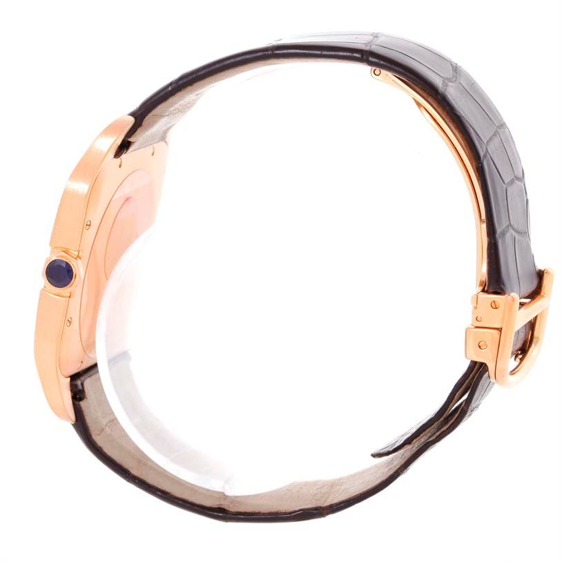 This image shows a side view of the Cartier Santos Dumont W2006951 Men
s Rose Gold Silver Dial W2006951 Men
s Rose Gold Silver Dial watch, focusing on the case profile, crown, and leather strap.