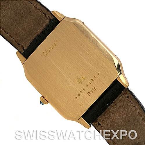 The image shows the case back of a Santos Dumont model by Cartier, viewed from the rear with visible engravings.